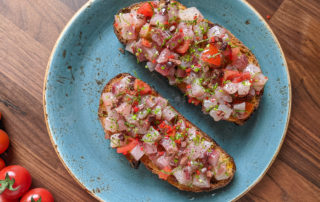 Fish tartare with tomato, olive and sumac